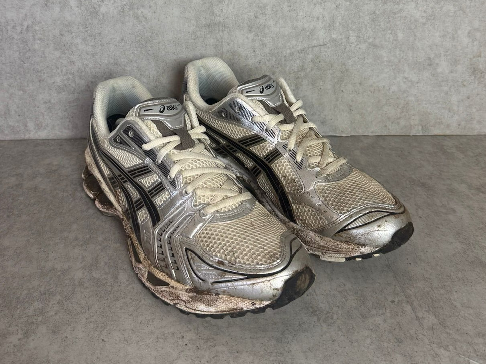 Asics Gel-Kayano in cream and silver before restoration